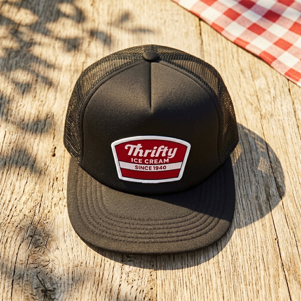 Thrifty Black Logo Trucker Hat